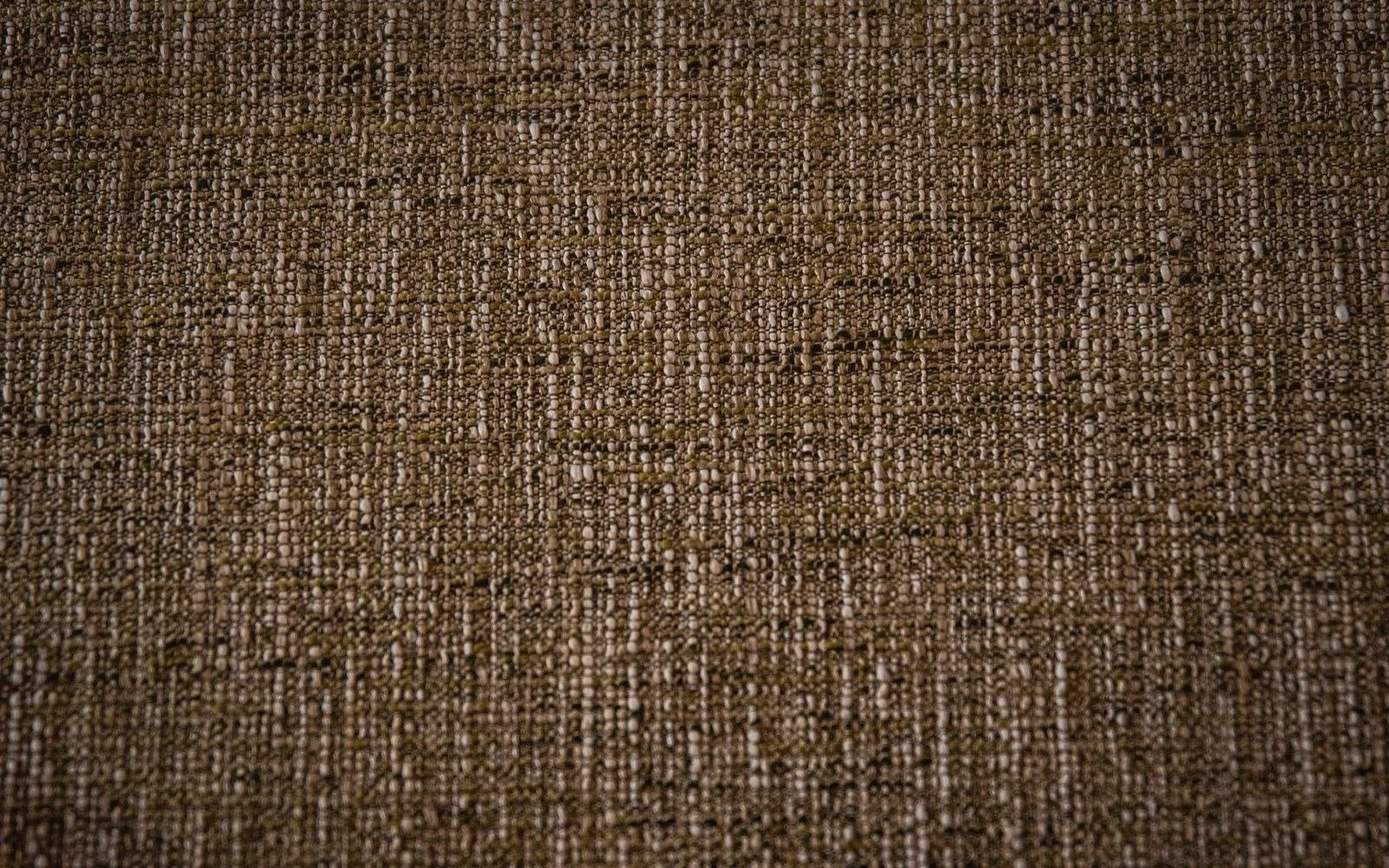 Extreme macro of unprimed linen canvas weave, individual threads visible, raking light picking out the texture