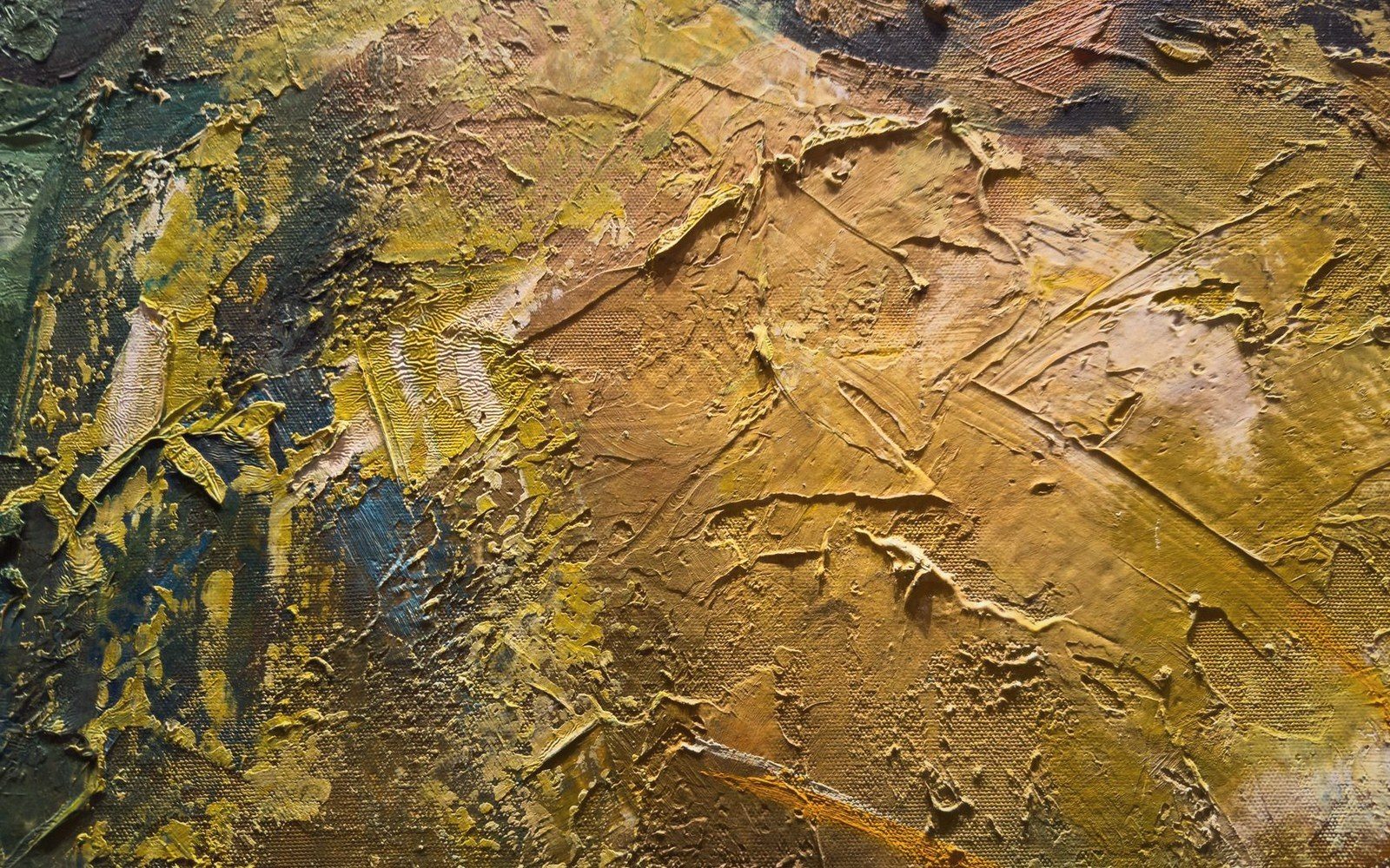 Close-up of thickly applied oil paint in gold and blue tones showing heavy brushstroke texture